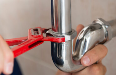Plumbing wrench and pipe