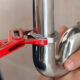 Plumbing wrench and pipe