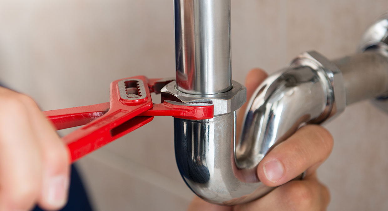 Plumbing wrench and pipe